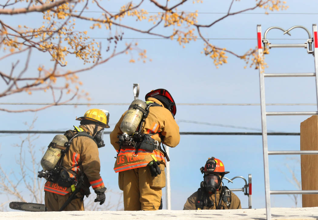 Las Vegas firefighters battle a house fire at 2417 Howard Drive on Tuesday, Feb. 18, 2020, in L ...