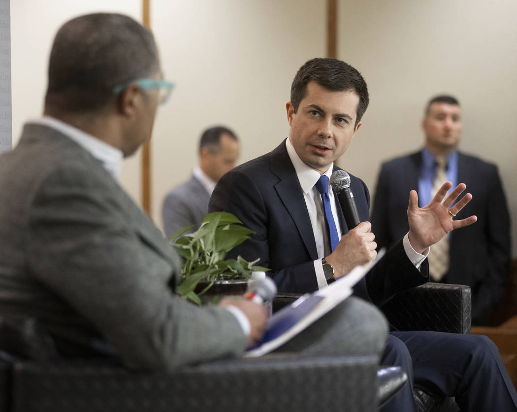 Democratic presidential candidate former South Bend Mayor Pete Buttigieg, right, speaks during ...