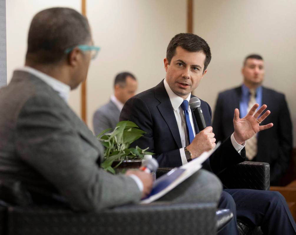 Democratic presidential candidate former South Bend Mayor Pete Buttigieg, right, speaks during ...
