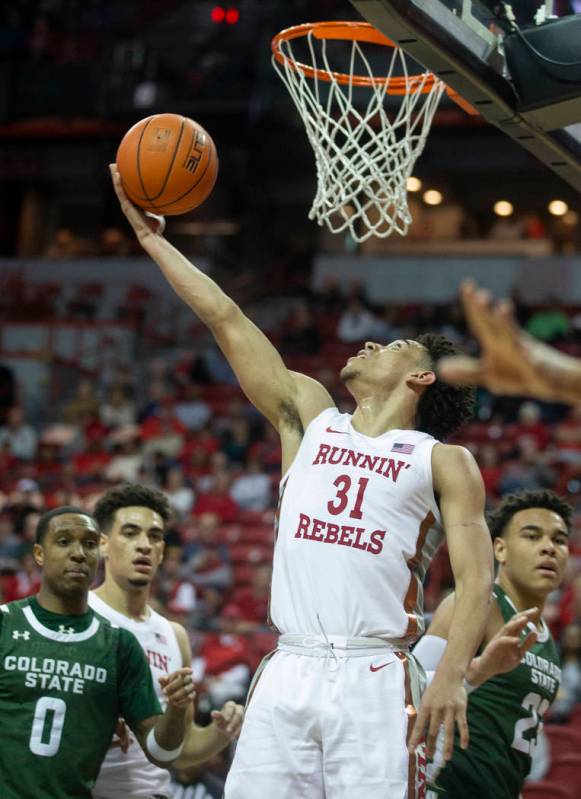 UNLV Rebels guard Marvin Coleman (31) slices to the rim past Colorado State Rams guard Hyron Ed ...
