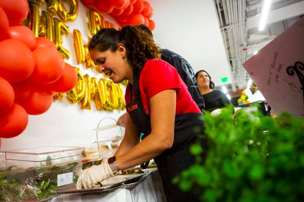 Claudia Andracki, owner of Desert Bloom Eco Farm, prepares food during a culinary celebration h ...