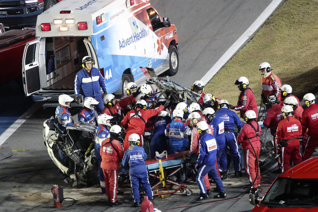 Rescue workers remove Ryan Newman from his car after he was involved in a wreck on the last lap ...