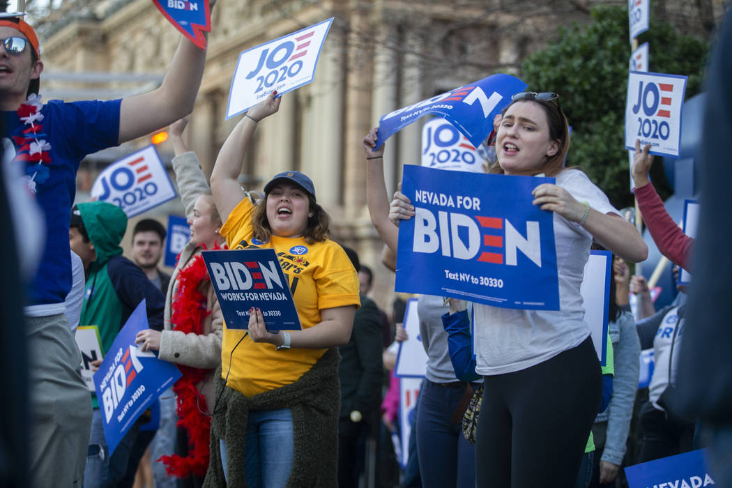 Supporters of Democratic presidential candidate former Vice President Joe Biden wave signs on t ...