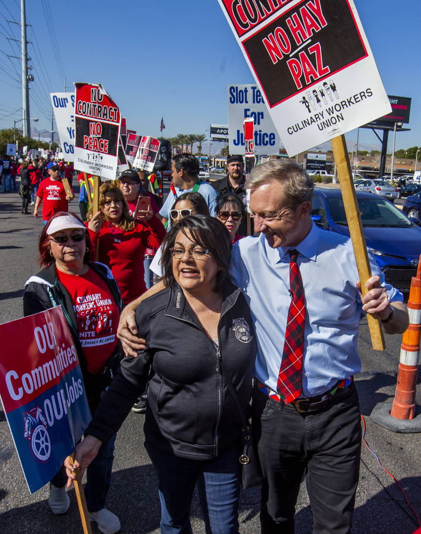 Democratic presidential candidate businessman Tom Steyer, right, walks with Alma Too of the Tea ...