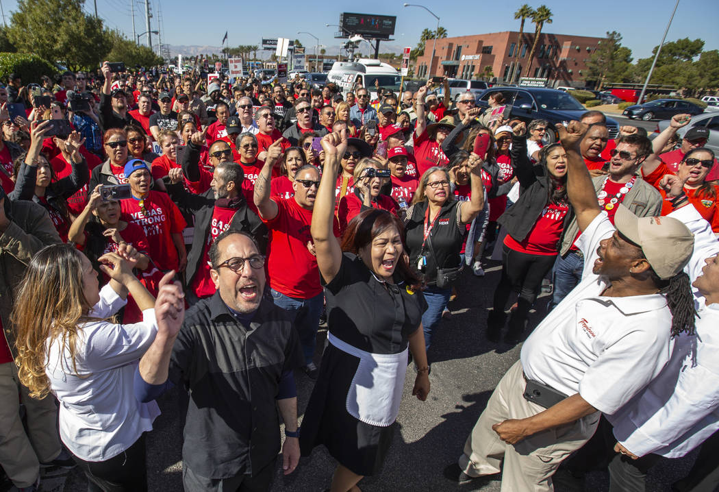 Workers from seven Station Casinos' properties rally together after walking a picket line fight ...