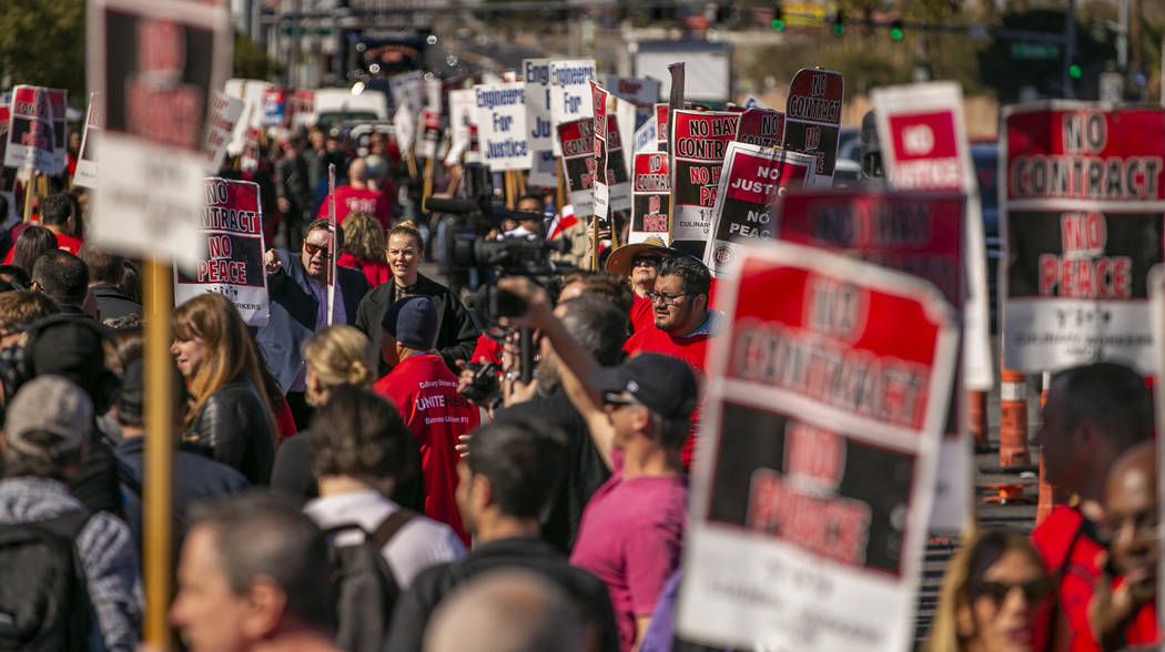 Workers from seven Station Casinos' properties walk a picket line while fighting for a union co ...