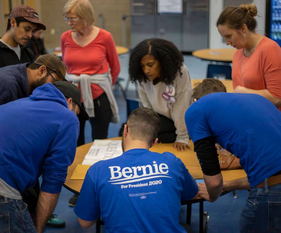 A group of Bernie Sanders supporters calculates ballots for their group during the Nevada caucu ...