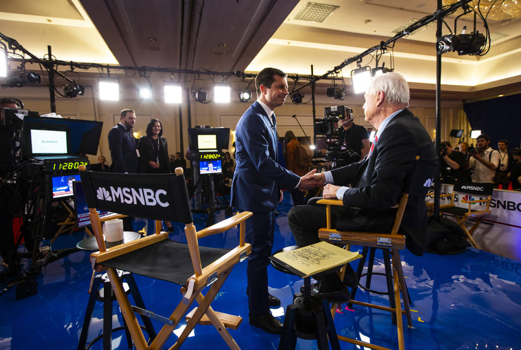 Democratic presidential candidate former South Bend Mayor Pete Buttigieg greets anchor Chris Ma ...