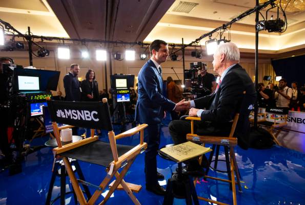 Democratic presidential candidate former South Bend Mayor Pete Buttigieg greets anchor Chris Ma ...