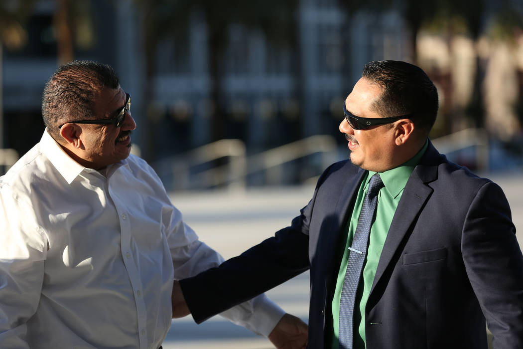 Pastor Palafox, left, greets Albert Lopez outside the federal courthouse in Las Vegas after the ...