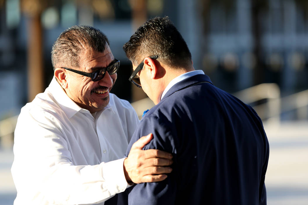 Pastor Palafox, left, greets Bradley Campos outside the federal courthouse in Las Vegas after t ...
