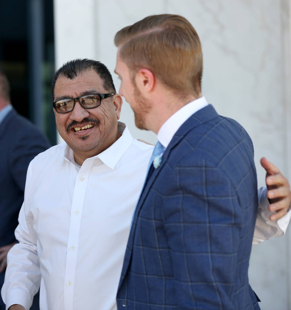 Pastor Palafox, left, greets attorney Dan Hill outside the federal courthouse in Las Vegas afte ...