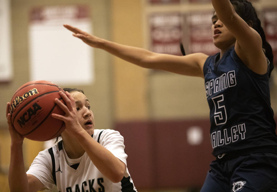 Desert Oasis's Isabella Jaramillo (2) looks to pass to a teammate as Spring Valley's Chelsea Ca ...