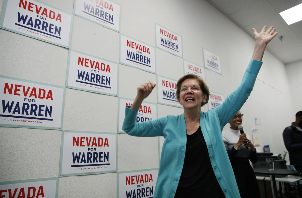 Democratic presidential candidate Sen. Elizabeth Warren, D-Mass., reacts as she speaks at a cam ...