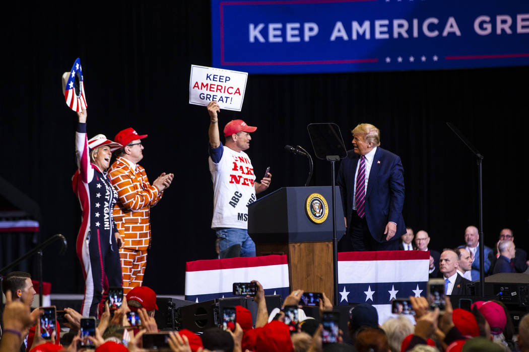 President Donald Trump welcomes supporters to the stage during a rally at the Las Vegas Convent ...