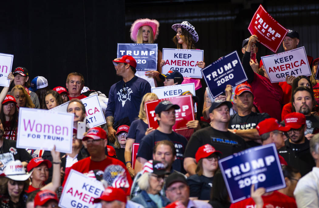 Supporters of President Donald Trump cheer before his arrival at a rally at the Las Vegas Conve ...