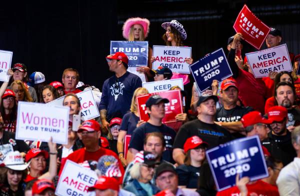 Supporters of President Donald Trump cheer before his arrival at a rally at the Las Vegas Conve ...