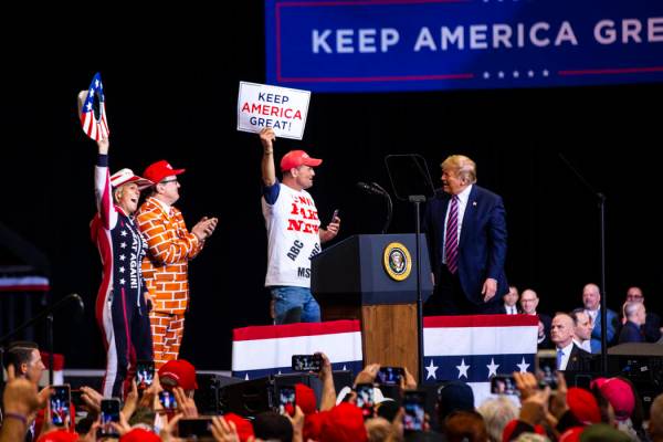President Donald Trump welcomes supporters to the stage during a rally at the Las Vegas Convent ...