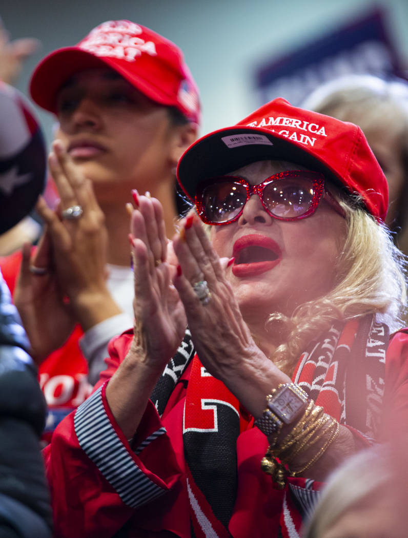 Supporters of President Donald Trump, not pictured, cheer as Vice President Mike Pence speaks a ...