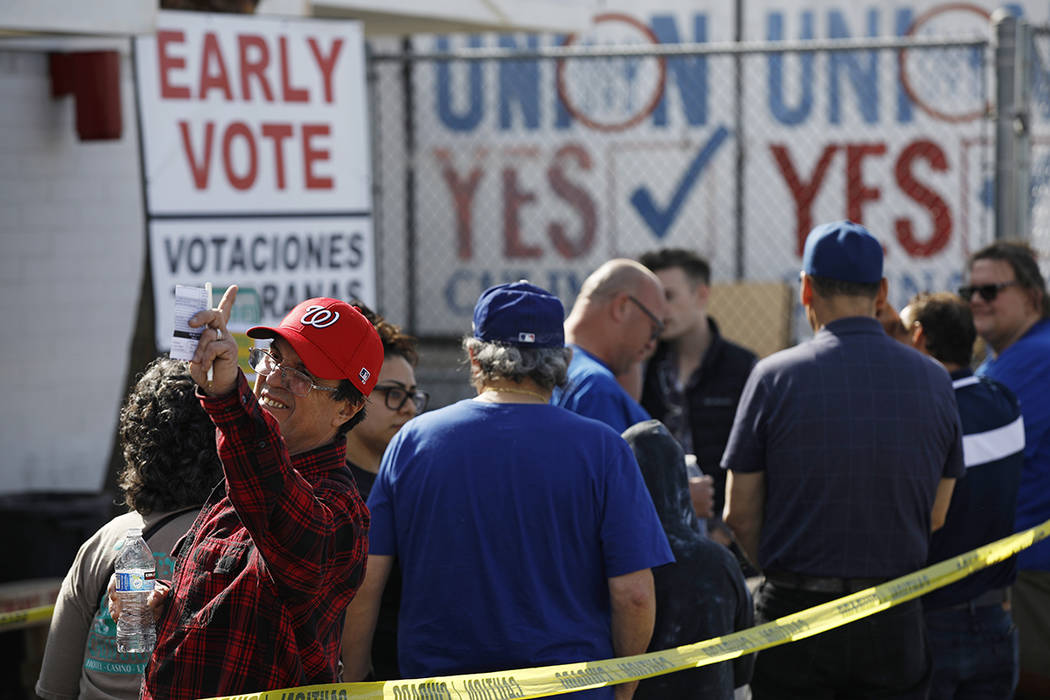 People wait in line to vote early at the Culinary Workers union Monday, Feb. 17, 2020, in Las V ...