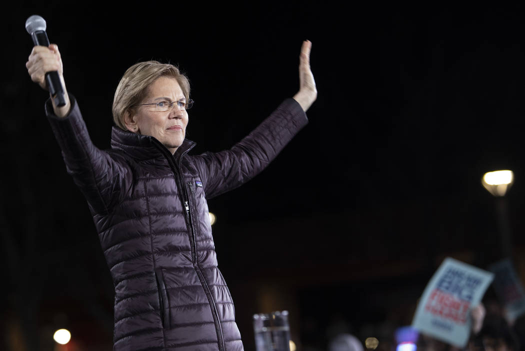 Sen. Elizabeth Warren, D-Mass., greets the crowd at the "Get Out the Caucus Block Party&qu ...