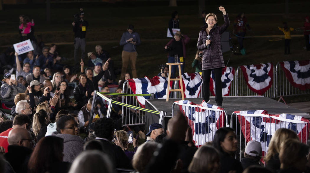 Sen. Elizabeth Warren, D-Mass., speaks to the crowd at her "Get Out the Caucus Block Party ...
