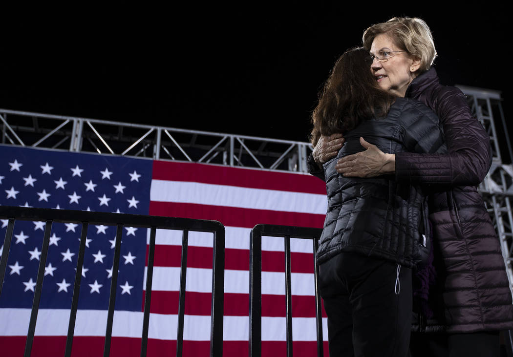 Sen. Elizabeth Warren, D-Mass., hugs Debbie Page-Kinsora after taking a selfie with her at the ...