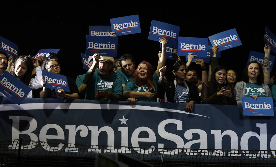 Supporters of Democratic presidential candidate Sen. Bernie Sanders, I-Vt., cheer as they watch ...