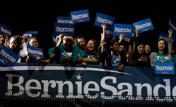 Supporters of Democratic presidential candidate Sen. Bernie Sanders, I-Vt., cheer as they watch ...