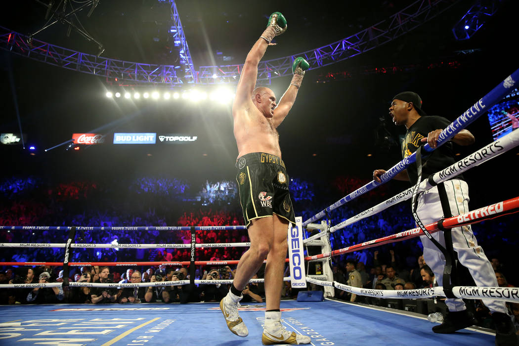 Tyson Fury reacts to his technical knockout win against Deontay Wilder in round 7 of the WBC wo ...