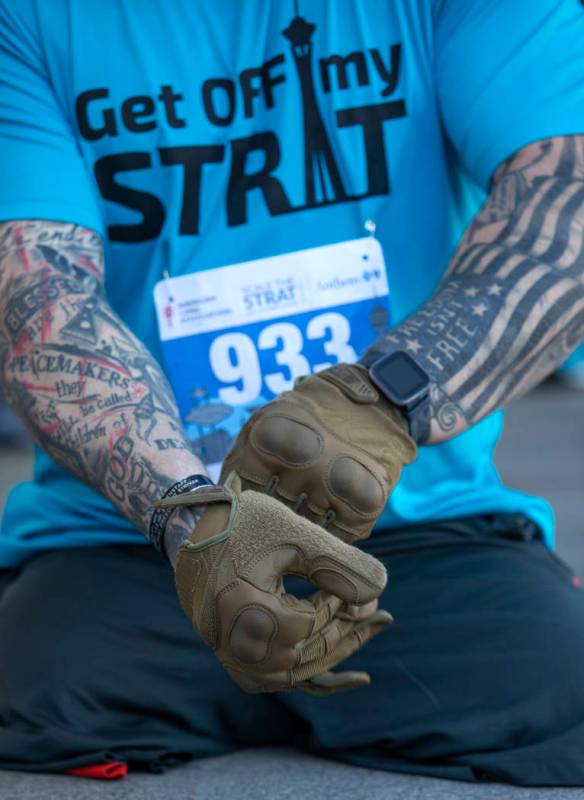 Travis Strong, a double amputee who lost both of his legs in Baghdad, puts on gloves to protect ...