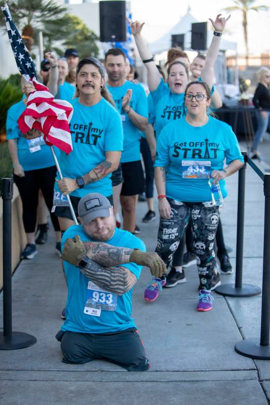 Travis Strong stretches as his teammates cheer behind him at the Strat on Sunday, Feb. 23, 2020 ...