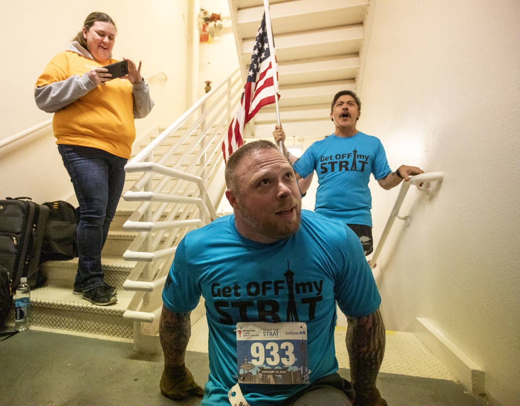 Travis Strong finishes climbing the 108th level of stairs at the Strat on Sunday, Feb. 23, 2020 ...