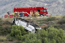 A bus rolled down an embankment off Interstate 15 in North San Diego County Saturday, Feb. 22, ...