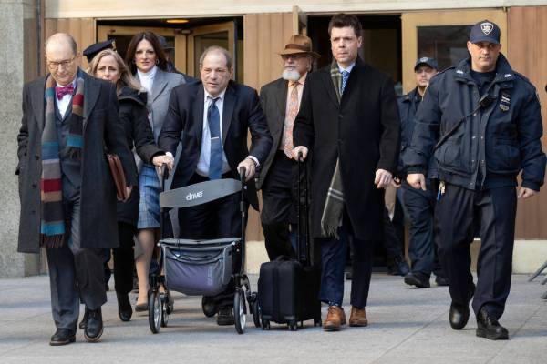 Harvey Weinstein, fourth from left, leaves the courthouse during jury deliberations in his rape ...