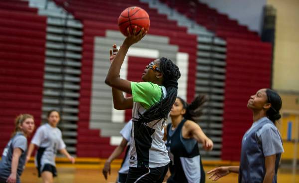 Player Jordan Stroud sets up a shot as the Desert Oasis girls basketball team practices on Mond ...