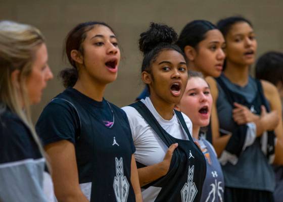 Desert Oasis girl's basketball team players yell out the next play to those on court during pra ...