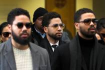 Actor Jussie Smollett, center, departs after an initial court appearance at the Leighton Crimin ...
