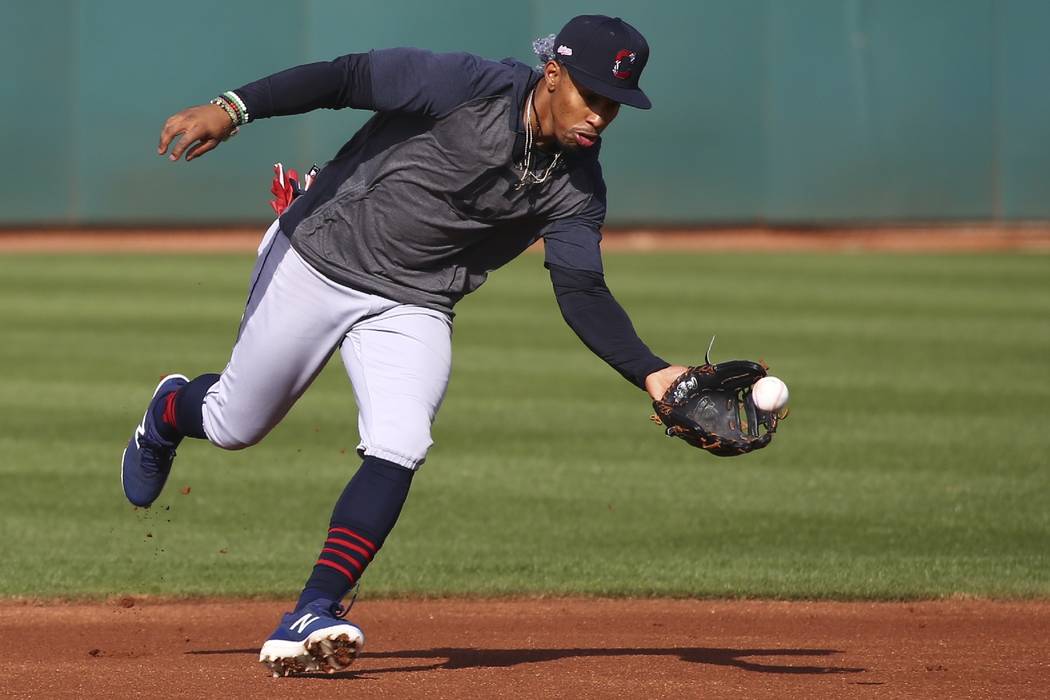 Cleveland Indians shortstop Francisco Lindor fields a grounder during baseball spring training ...