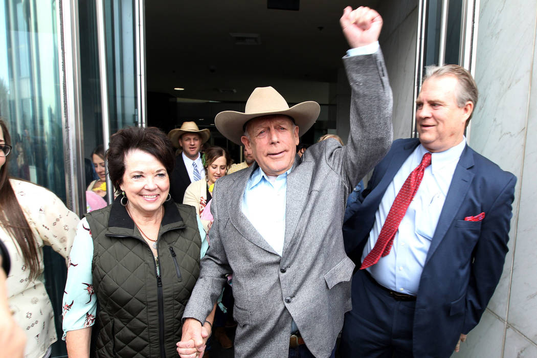 Cliven Bundy walks out of Lloyd D. George U.S. Courthouse in Las Vegas a free man with his wife ...