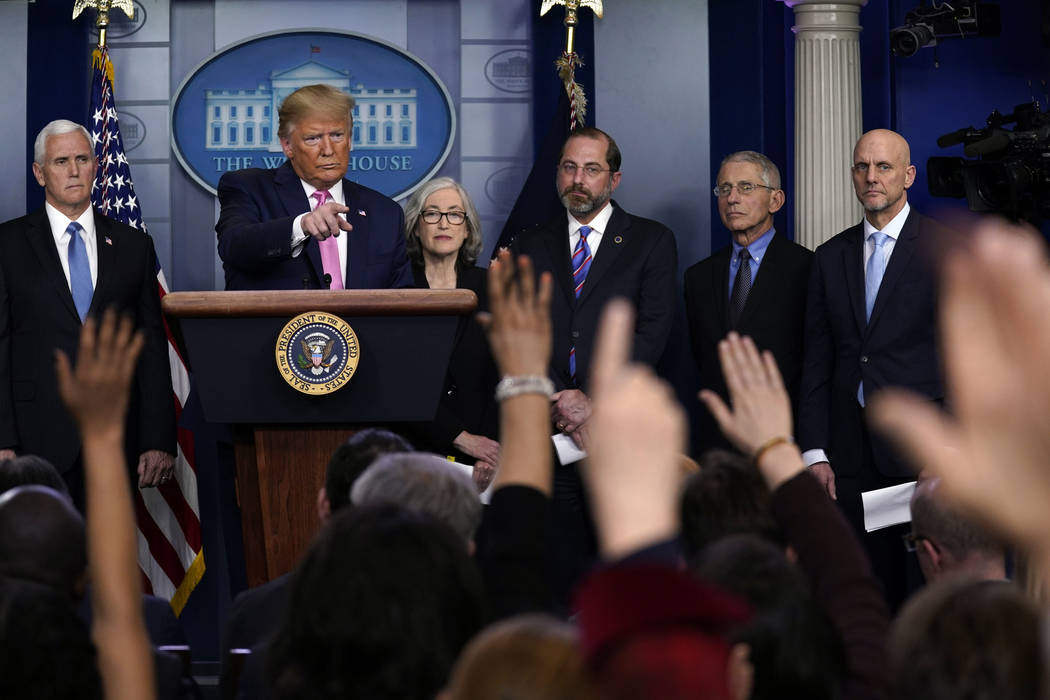 President Donald Trump, with members of the president's coronavirus task force, speaks during a ...
