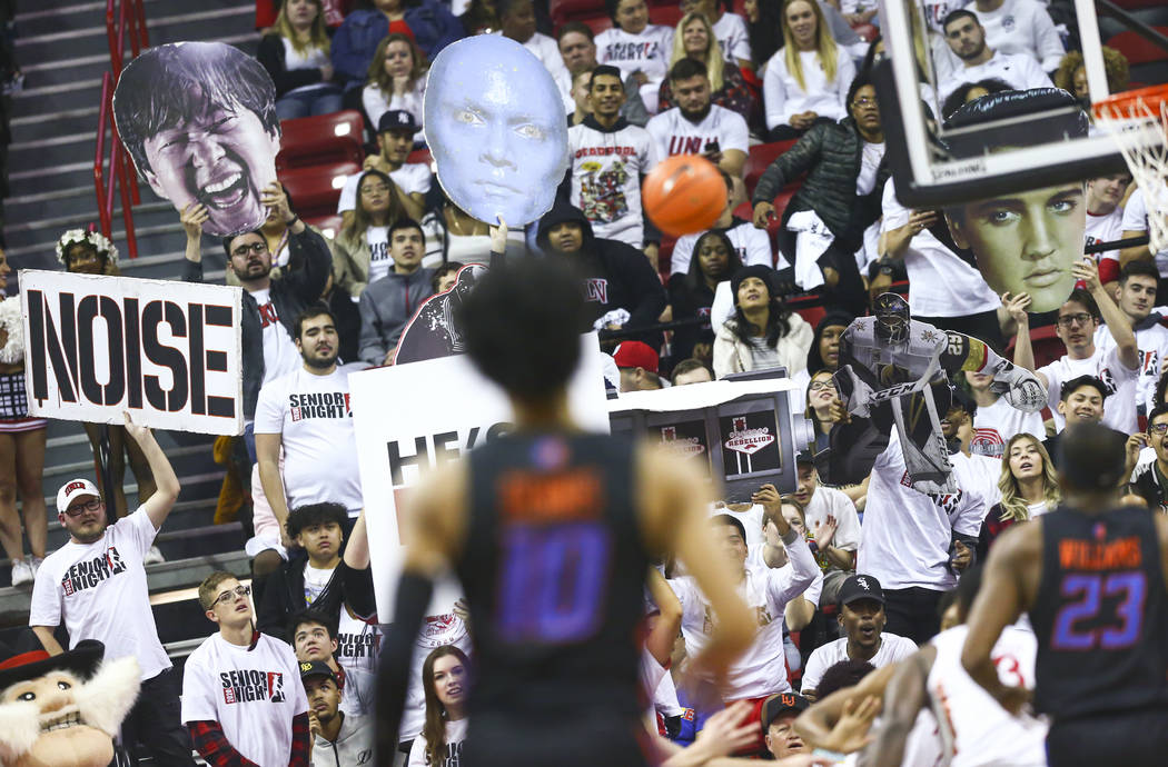 UNLV fans try to distract a Boise State Broncos player during the first half of a basketball ga ...