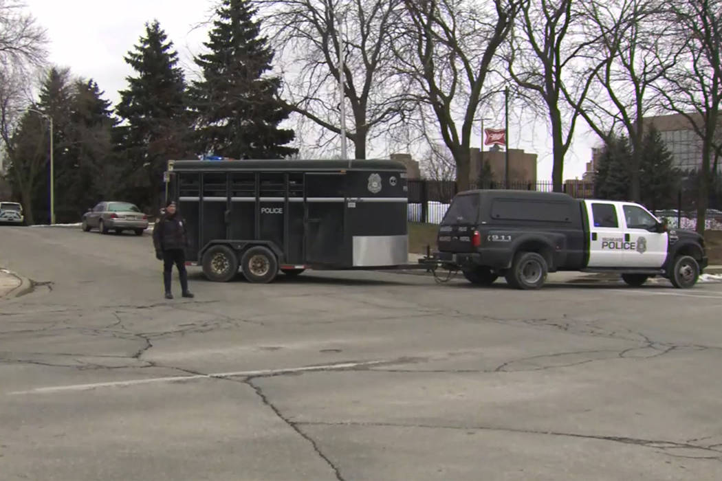 This image provided by WISN-TV, police respond to a possible shooting at the MillerCoors campus ...