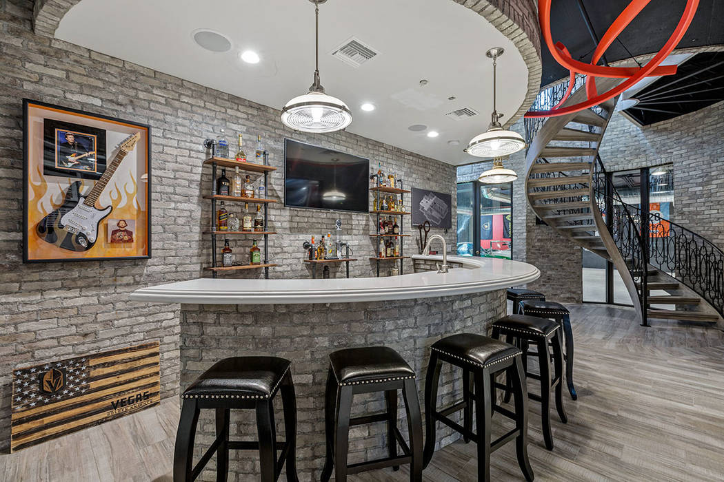 The 5,000-square-foot basement has a bar. (Ivan Sher Group)