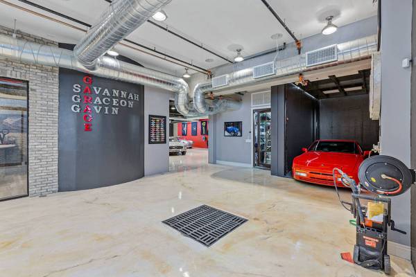 The two-level garage has an elevator to transport cars. (Ivan Sher Group)