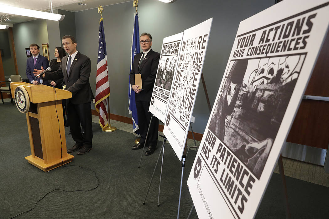 Raymond Duda, FBI Special Agent in Charge in Seattle, speaks during a news conference at a podi ...