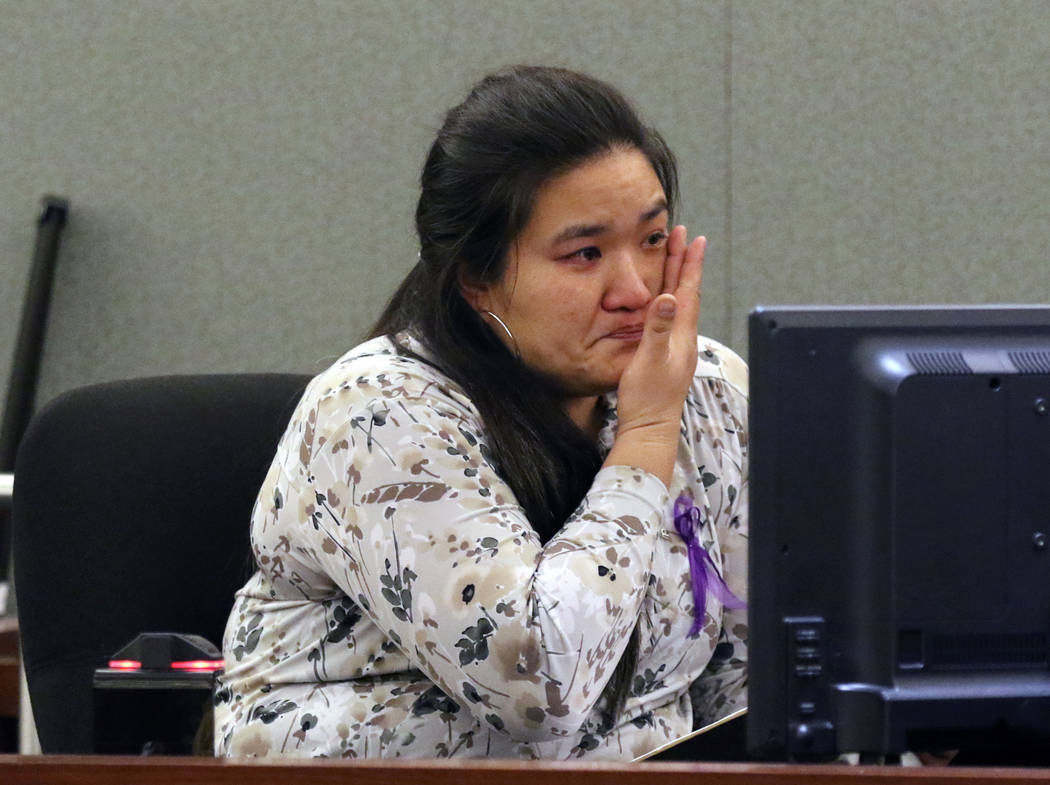 Kerri Anderson, the aunt of murder victim 3-year-old Abygaile Bennett, weeps as she reads her i ...