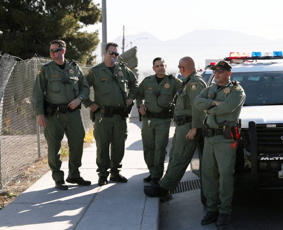 Officers with the Metropolitan Police Department are seen at a brief for members of the media a ...