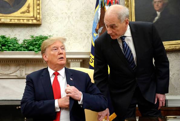 White House Chief of Staff John Kelly, right, leans in to talk with President Donald Trump duri ...