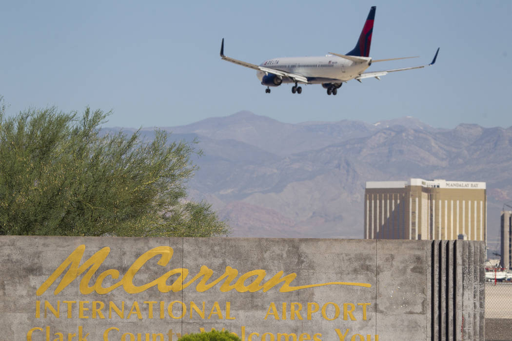 A Delta Airlines jetliner makes its approach to McCarran International Airport in Las Vegas on ...